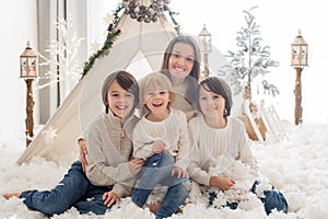 Happy family, enjoying christmas together in cozy home, decorated