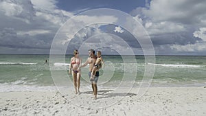 Happy family enjoying morning walk on the beach 4k