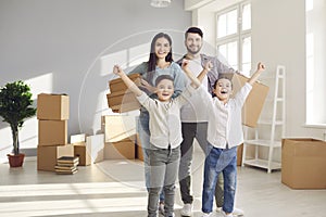 Happy family enjoying relocating to new apartment concept photo