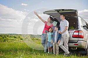 Happy family enjoying road trip and summer vacation