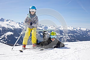 Happy family, enjoying ski holiday with children, sunny beautiful weather