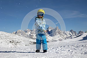 Happy family, enjoying ski holiday with children, sunny beautiful weather