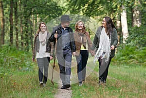 Happy family enjoying a stroll through the woods