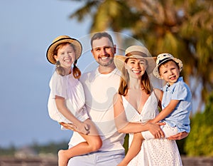 Happy family enjoying summer day in countryside