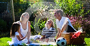 Happy family enjoying the sun in a picnic