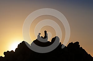 Happy family enjoying the sunset