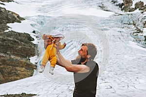 Happy family father and baby daughter traveling together