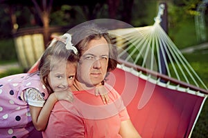 Happy family, father and daughter relax in the summer outdoors i