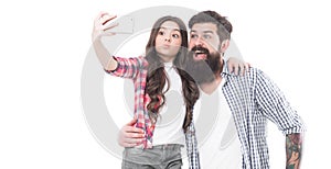 Happy family father and daughter take self-portrait with mobile camera phone, selfie