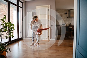 Happy family father and his daughter having fun time at home