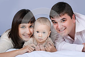 Happy family - father, mother and baby