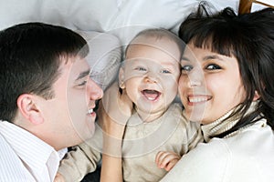 Happy family - father, mother and baby