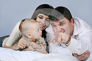 Happy family - father, mother and baby