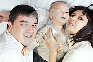 Happy family - father, mother and baby