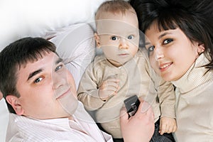 Happy family - father, mother and baby