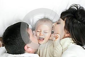 Happy family - father, mother and baby