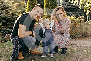 Happy family father, mother and child daughter outdoor  enjoying  sunset  - Image