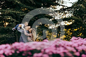 Happy family father, mother and child daughter outdoor  enjoying  sunset  - Image