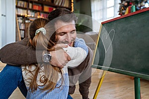 Happy family and father& x27;s day. Father and his daughter hugging and having fun together