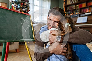 Happy family and father& x27;s day. Father and his daughter hugging and having fun together