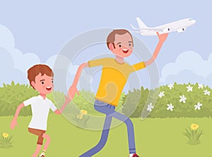 Happy family, father and son playing with toy airplane