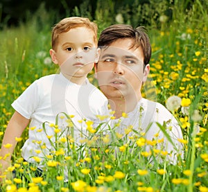 Happy family father and son relaxing in the park