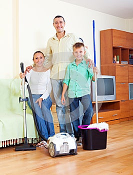 Happy family finished cleaning in home