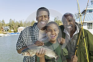 Happy Family With Fishing Rod And Fish