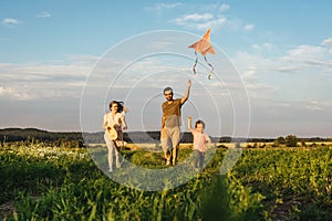 Happy family flying a kite