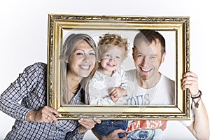 Happy family framed by a picture frame