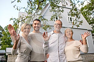 Happy family in front of house outdoors