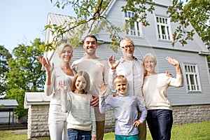 Happy family in front of house outdoors