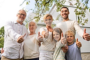 Happy family in front of house outdoors