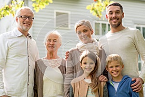 Happy family in front of house outdoors