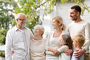 Happy family in front of house outdoors