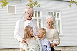 Happy family in front of house outdoors