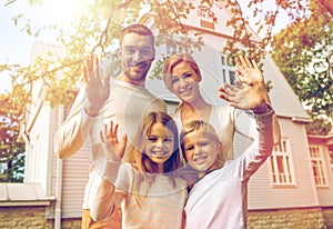 Happy family in front of house outdoors