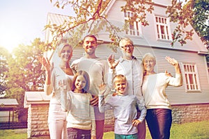 Happy family in front of house outdoors