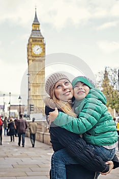 Happy family in front of a popular London sight Big Ben photo