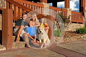 Happy family on front steps