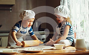 Happy family funny kids bake cookies in kitchen