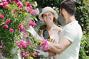 Happy family in garden flowers