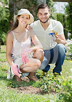 Happy family in garden with horticultural sundry photo