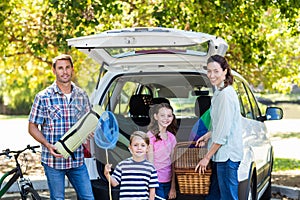 Happy family getting ready for road trip