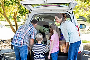 Happy family getting ready for road trip