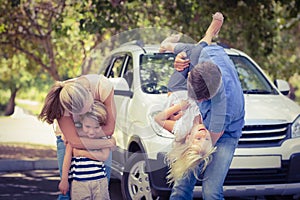 Happy family getting ready for road trip