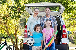 Happy family getting ready for road trip