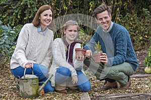 Happy Family Girl Child Father Mother Daughter Gardening