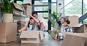 Happy family, girl and playing with box in new home for fun moving in, bonding or property together. Dad pushing child