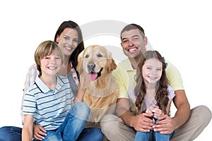 Happy family with golden retriever